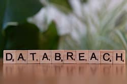 EDR vs. Antivirus: Why Sticking with Old Security Is a Dangerous Risk 4 Commercial Networks image of Data Breach on Scrabble tiles for EDR