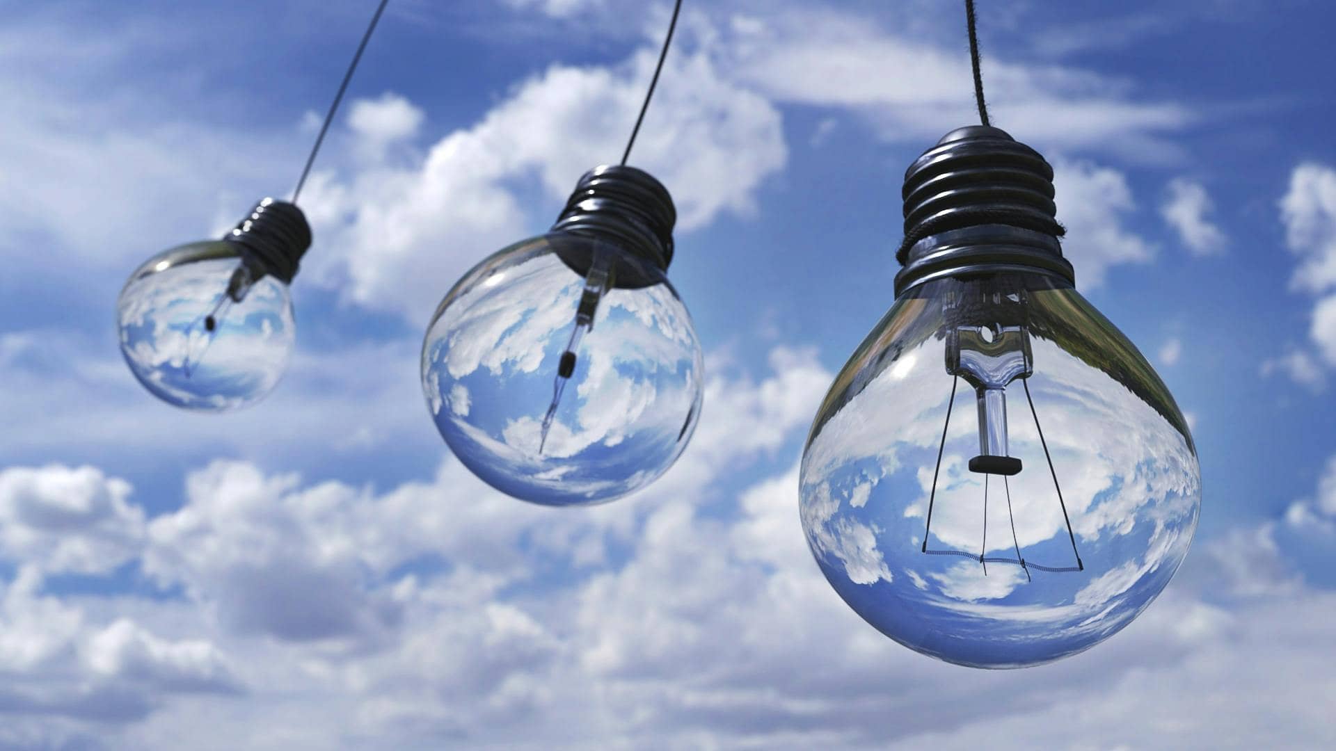 Commercial Networks Cloud-first strategy image with light bulbs against cloudy sky